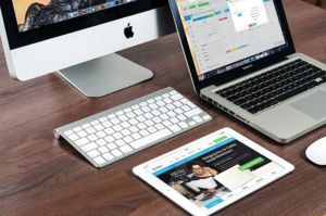 800px Paperless work desk with an iPad iMac and a MacBook