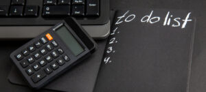 bottom view list written notepad calculator keyboard black table (1)